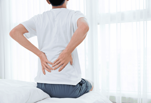 Man Waking With Back Pain